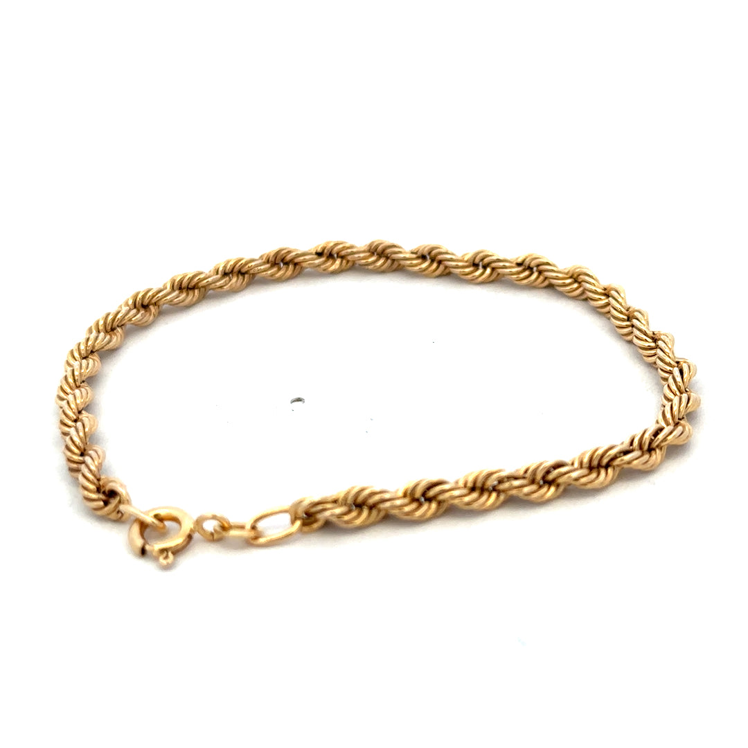 9ct yellow gold rope bracelet weighing 2.4g, featuring a detailed twisted design, from Reeves and Sons.
