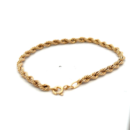9ct yellow gold rope bracelet weighing 2.4g, featuring a detailed twisted design, crafted by Reeves and Sons.