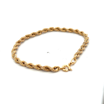 9ct yellow gold rope bracelet weighing 2.4g with intricate twisted design, crafted by Reeves and Sons.