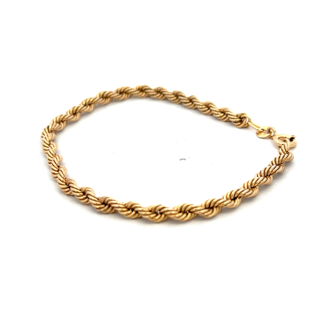 9ct yellow gold rope bracelet weighing 2.4g, featuring a twisted design with a secure clasp, by Reeves and Sons.