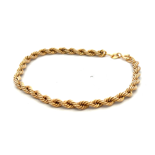 9ct yellow gold rope bracelet from Reeves and Sons, showcasing a detailed twisted gold design with a secure clasp.