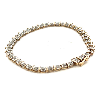 9ct yellow gold diamond bracelet with intricate links, weighing 5.9g, featuring sparkling diamonds from Reeves and Sons.