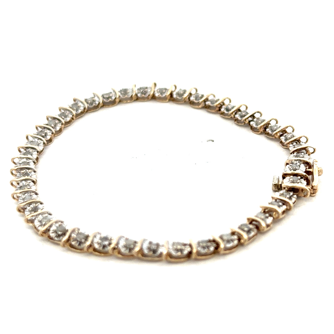 9ct yellow gold diamond bracelet with intricate design and sparkling diamonds, weighing 5.9g, by Reeves and Sons.