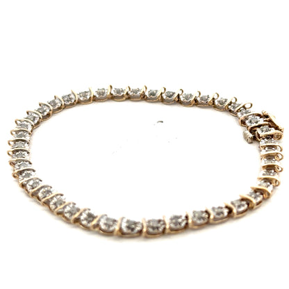 9ct yellow gold diamond bracelet weighing 5.9g with sparkling diamonds, featuring a delicate chain and clasp from Reeves and Sons