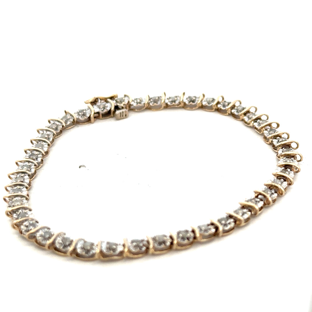 9ct yellow gold diamond bracelet with intricate design and sparkling diamonds, weighing 5.9g, from Reeves and Sons.