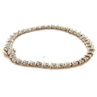 9ct yellow gold diamond bracelet with delicate link design, weighing 5.9g, from Reeves and Sons.
