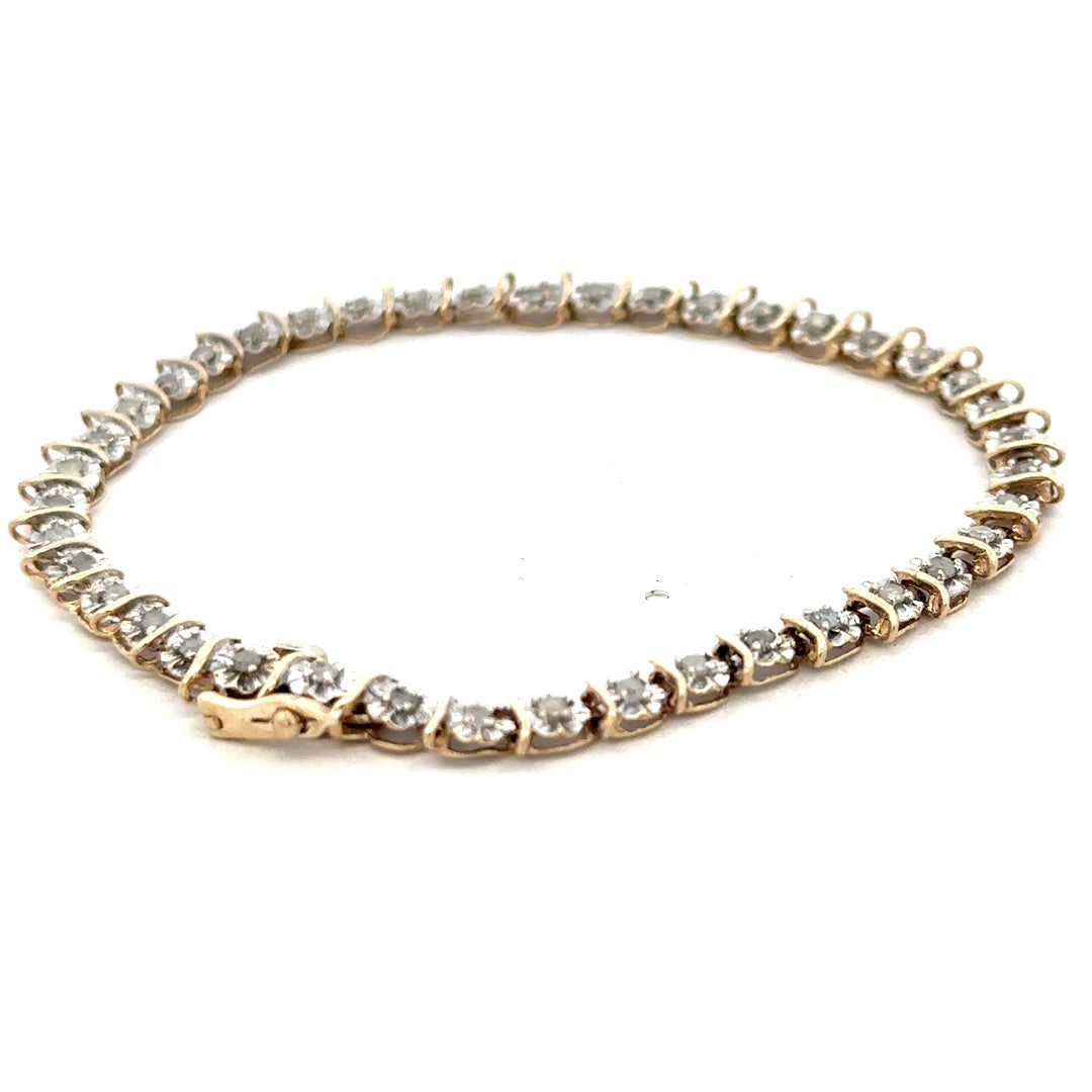 9ct yellow gold diamond bracelet weighing 5.9g with sparkling diamonds, designed by Reeves and Sons, displayed on a neutral background.