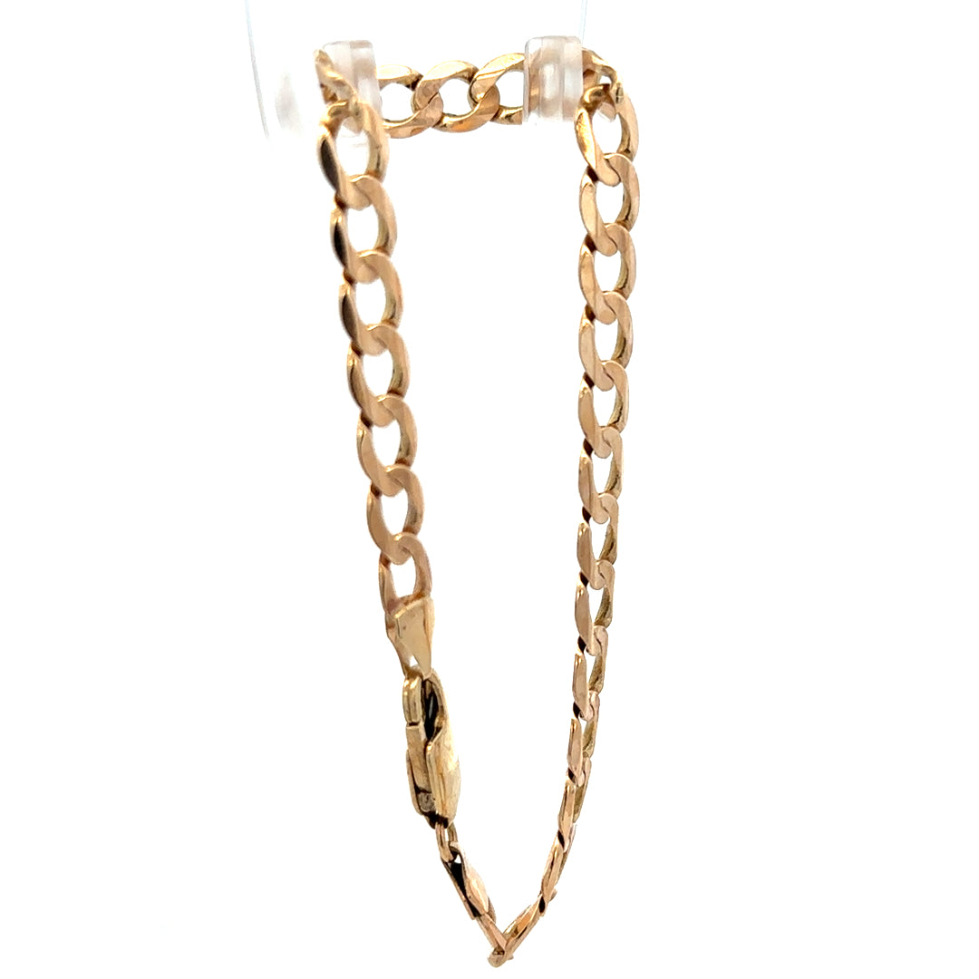 9ct yellow gold curb bracelet weighing 10.6g, featuring classic linked chain design, from Reeves and Sons.