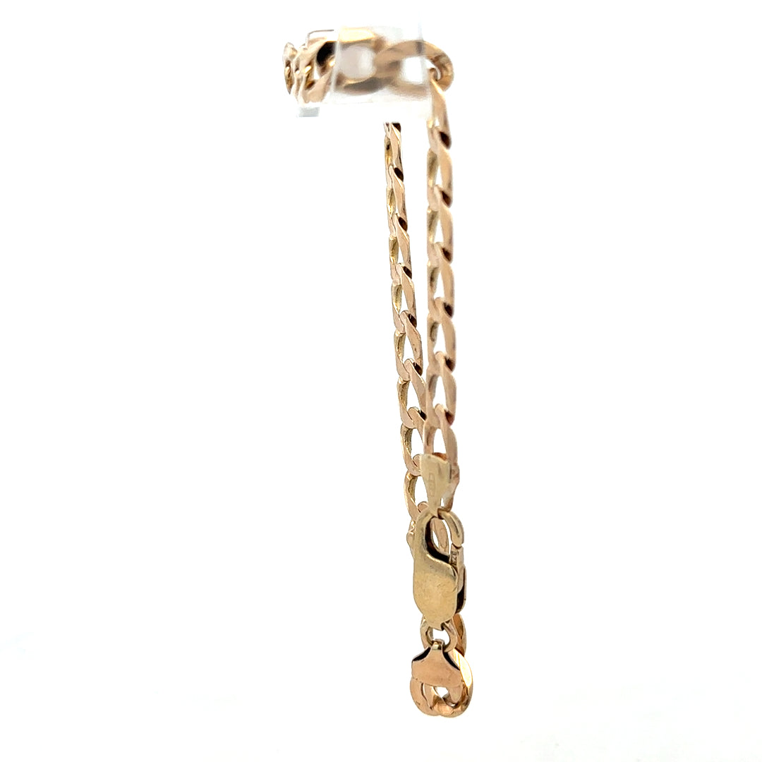 9ct yellow gold curb bracelet weighing 10.6g from Reeves and Sons, showcasing linked gold chain on a neutral background.
