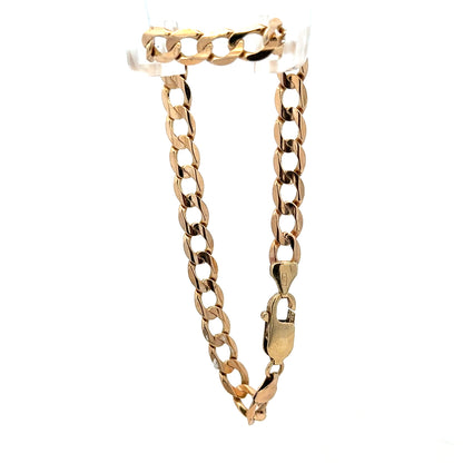 9ct yellow gold curb bracelet weighing 10.6g, featuring linked gold loops, crafted by Reeves and Sons.
