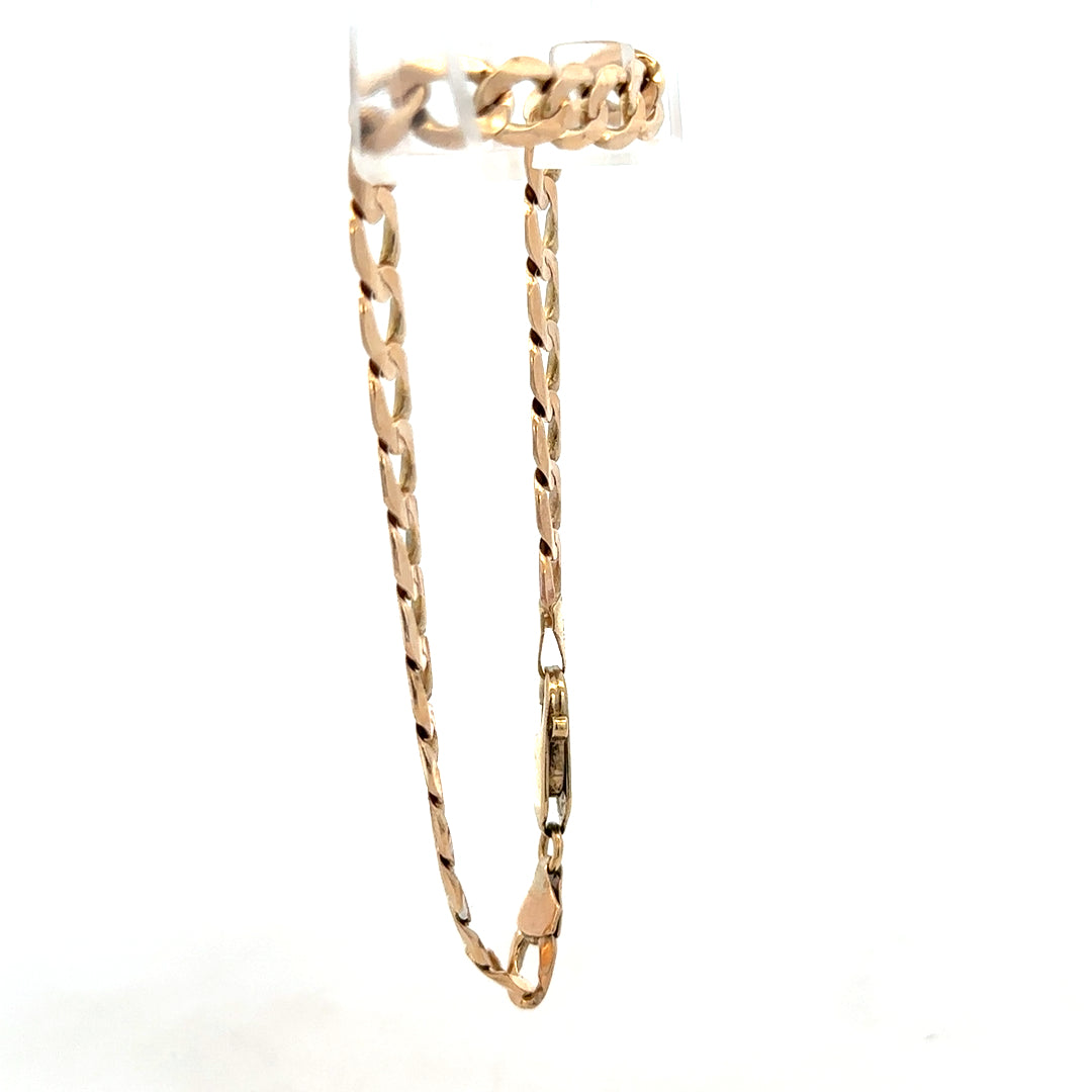 9ct yellow gold curb bracelet weighing 10.6g, featuring a classic link design from Reeves and Sons.