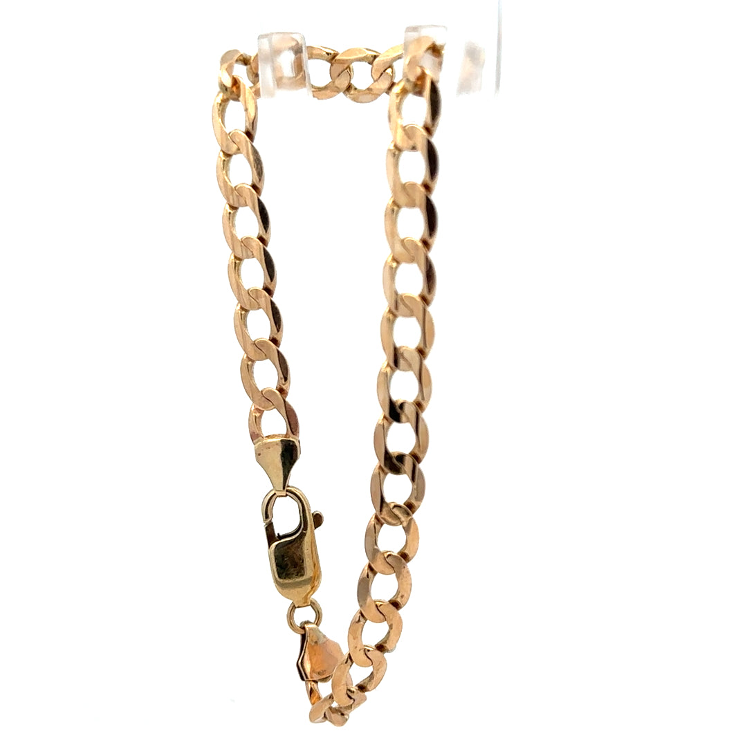 9ct yellow gold curb bracelet weighing 10.6g with polished links, crafted by Reeves and Sons.