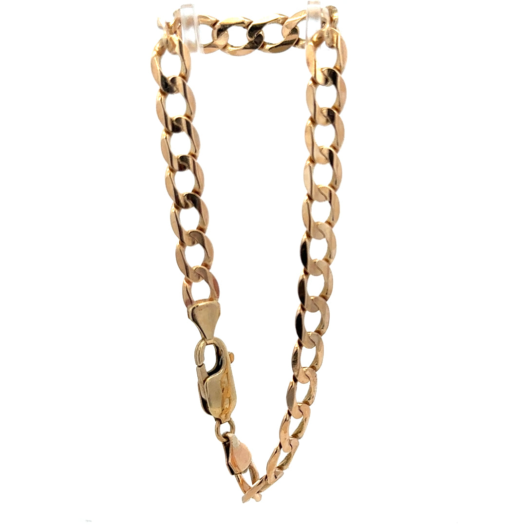 9ct yellow gold curb bracelet weighing 10.6g, featuring classic linked chain design, from Reeves and Sons.