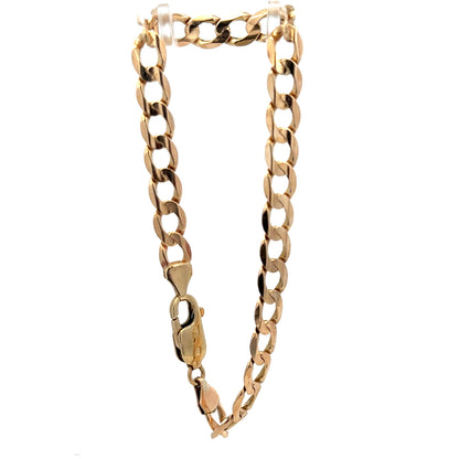 9ct yellow gold curb bracelet weighing 10.6g, featuring classic linked chain design, from Reeves and Sons.