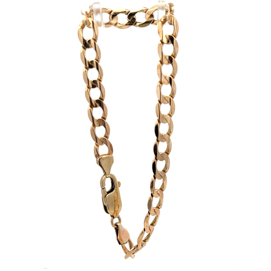 9ct yellow gold curb bracelet weighing 10.6g, featuring classic linked chain design, from Reeves and Sons.