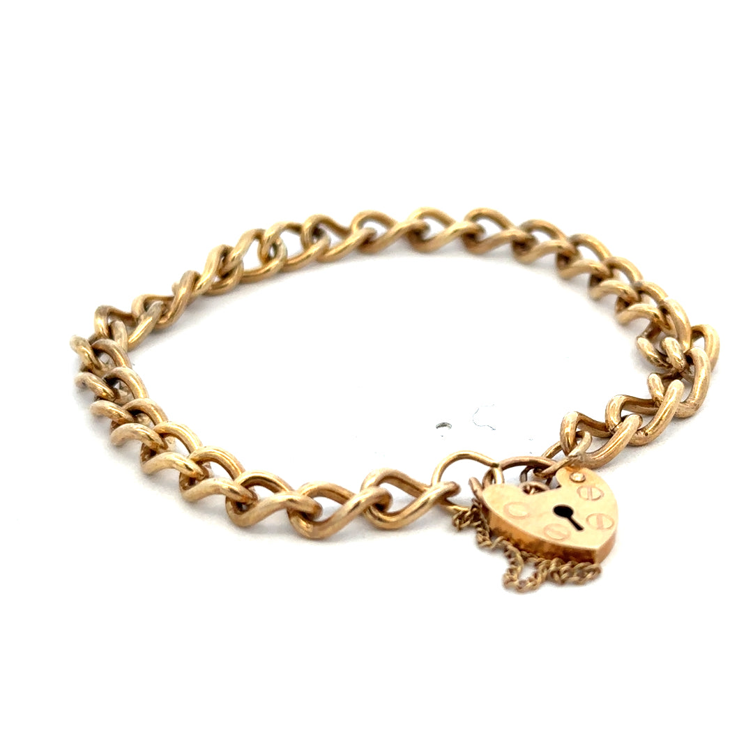 9ct yellow gold bracelet weighing 13.2g by Reeves and Sons, featuring a sleek, polished design with intricate detailing.