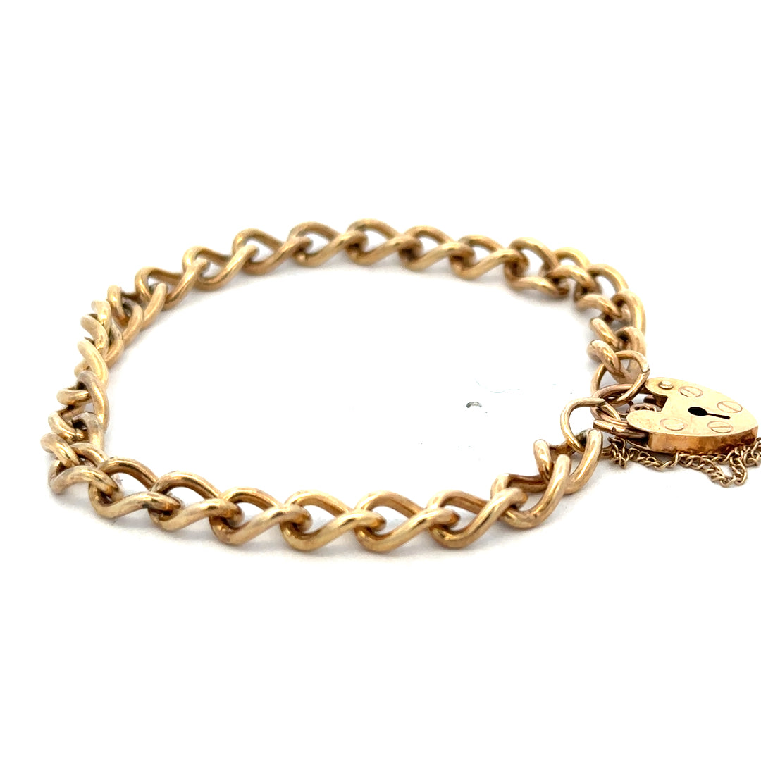 9ct yellow gold bracelet weighing 13.2g from Reeves and Sons, featuring a smooth, polished finish and elegant design.