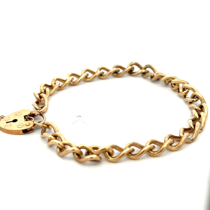 9ct yellow gold bracelet weighing 13.2g with intricate link design, crafted by Reeves and Sons.