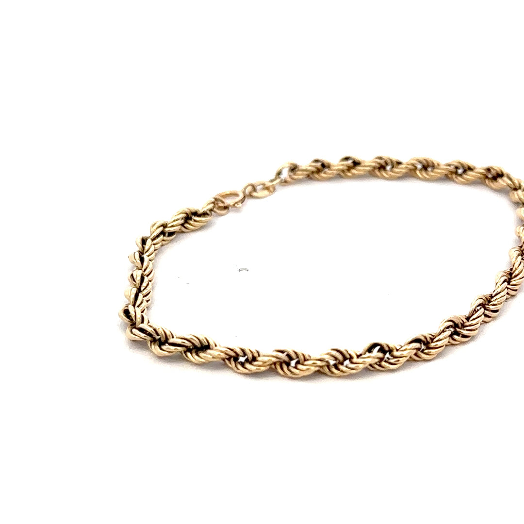 9ct yellow gold rope bracelet weighing 2.8g, featuring a twisted chain design, by Reeves and Sons.