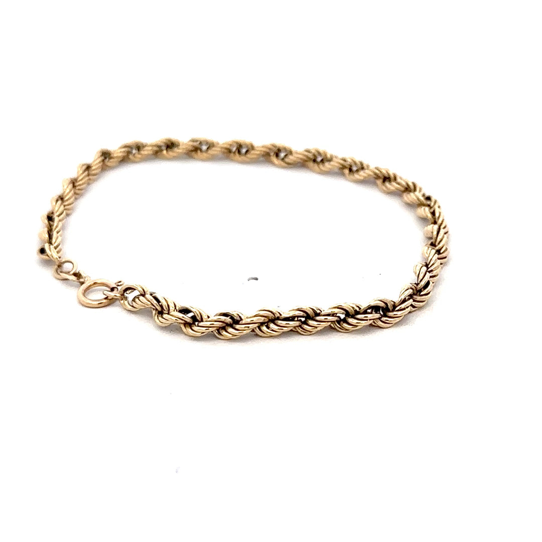9ct yellow gold rope bracelet weighing 2.8g, featuring a twisted chain design, crafted by Reeves and Sons.
