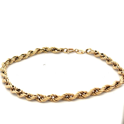 9ct yellow gold rope bracelet with a textured design, weighing 2.8g, from Reeves and Sons.
