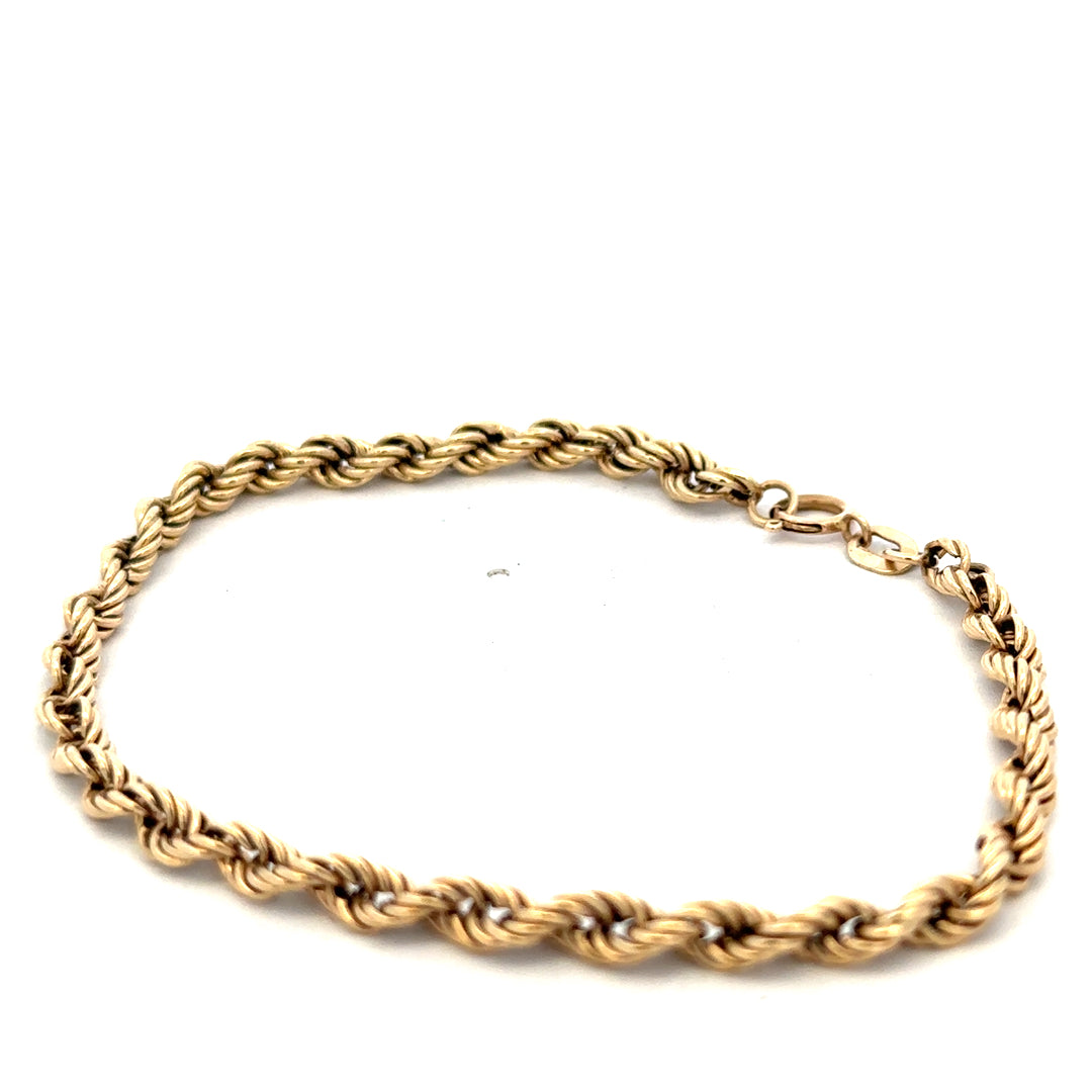 9ct yellow gold rope bracelet weighing 2.8g, featuring a twisted design and secure clasp, from Reeves and Sons.