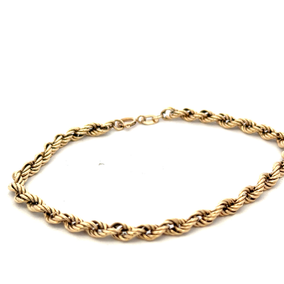 9ct yellow gold rope bracelet weighing 2.8g with intricate twisted design, crafted by Reeves and Sons.