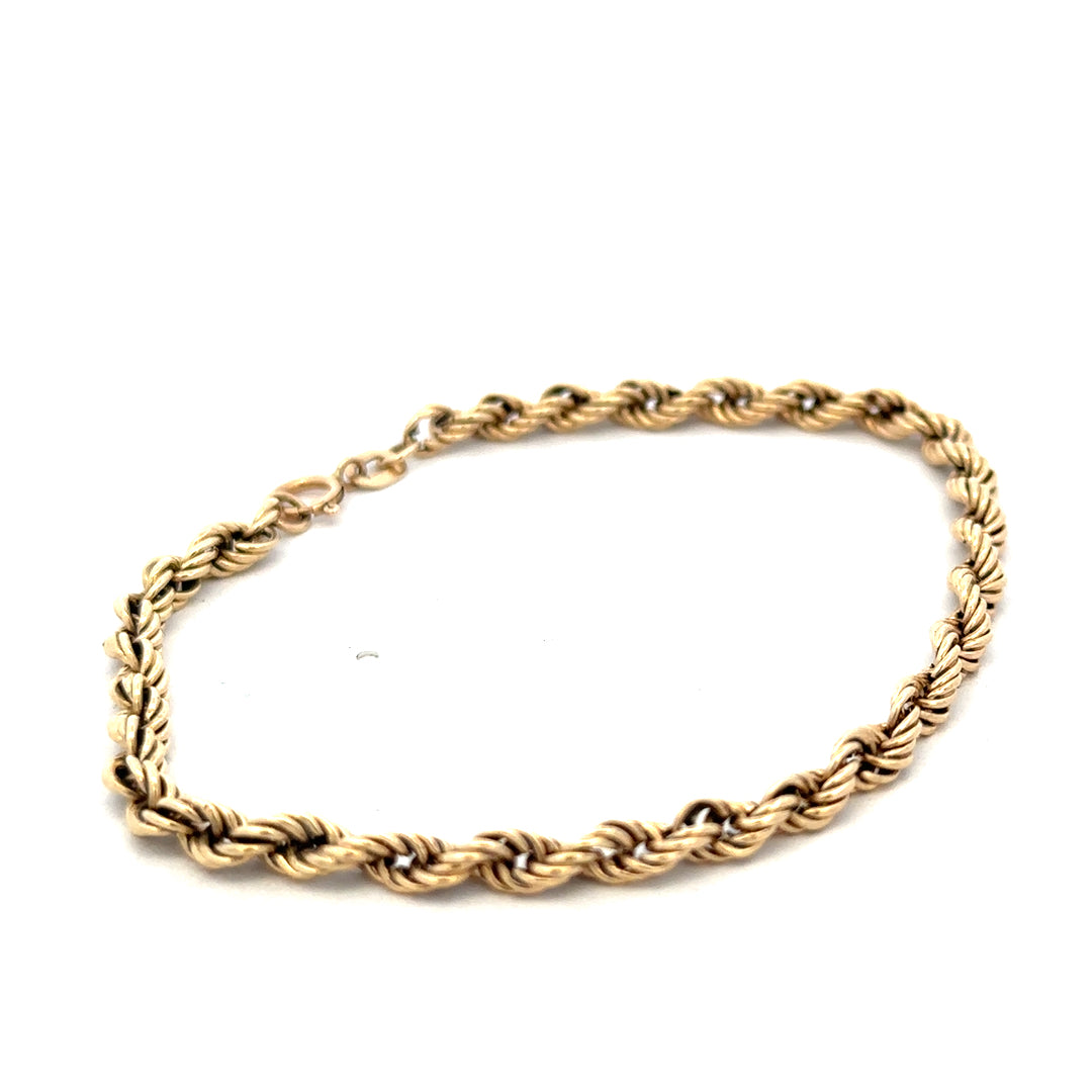 9ct yellow gold rope bracelet weighing 2.8g, featuring intricate twisted design, from Reeves and Sons.