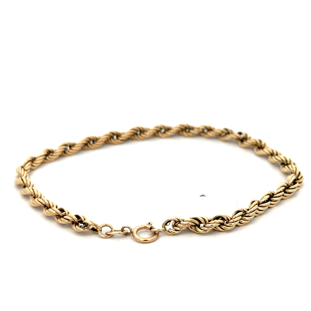 9ct yellow gold rope bracelet weighing 2.8g, featuring a twisted design with a secure clasp, by Reeves and Sons.