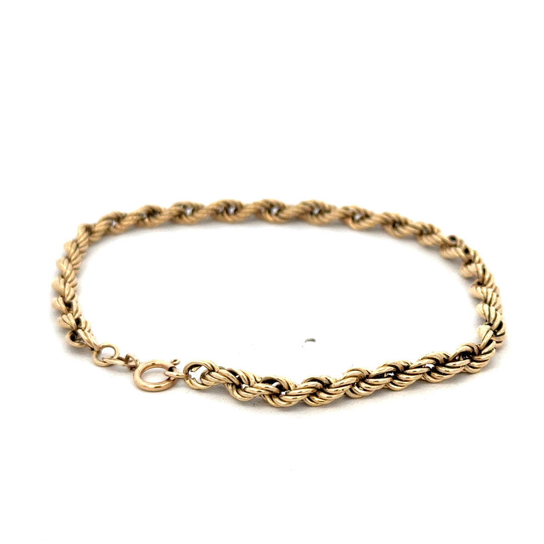 9ct yellow gold rope bracelet weighing 2.8g, with intricate twisted design, crafted by Reeves and Sons.