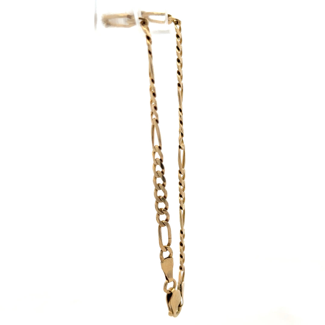 9ct yellow gold Figaro bracelet weighing 4.2g with linked chain design, crafted by Reeves and Sons.