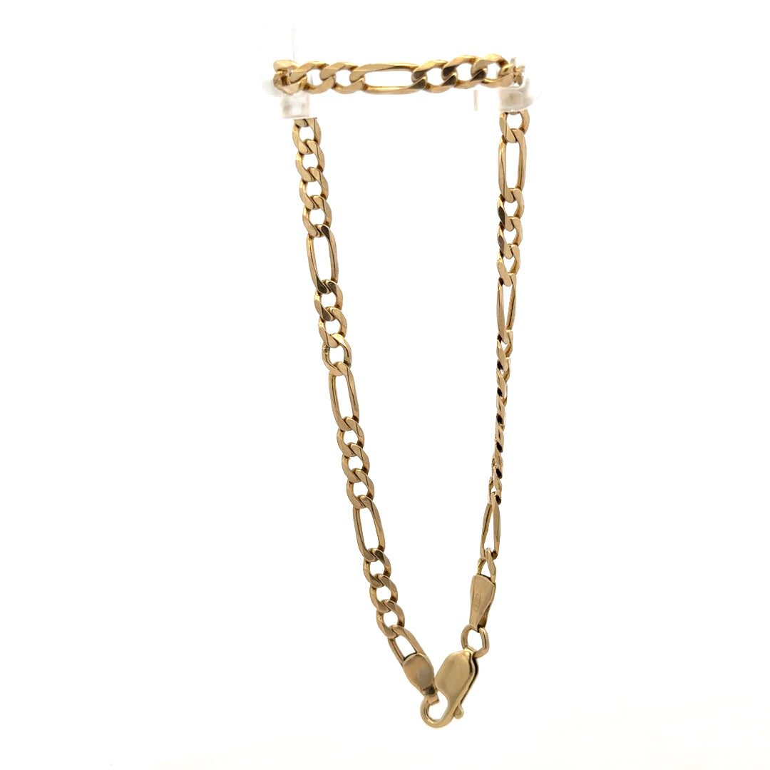 9ct yellow gold figaro bracelet weighing 4.2g, featuring interlinked chain links, crafted by Reeves and Sons.