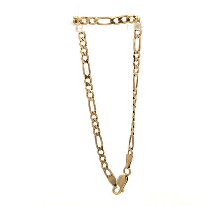 9ct yellow gold figaro bracelet weighing 4.2g, featuring interlinked chain links, crafted by Reeves and Sons.