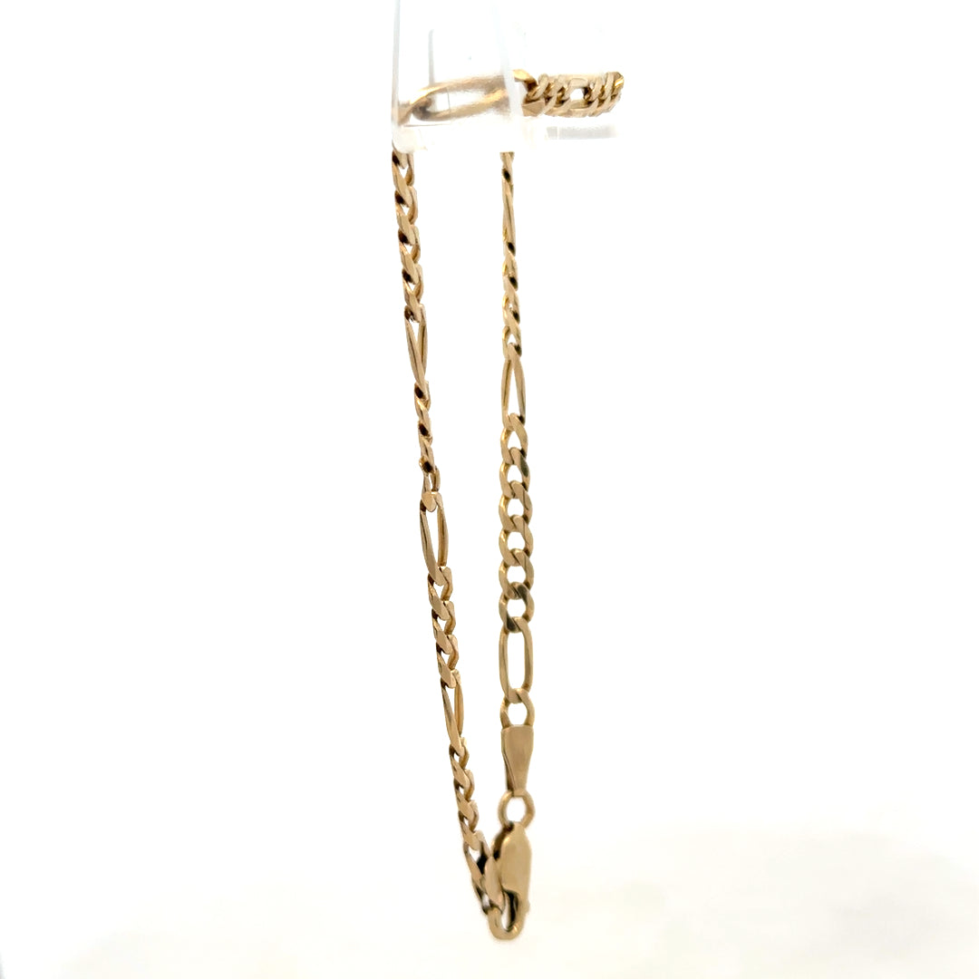 9ct yellow gold Figaro bracelet weighing 4.2g, featuring classic linked chain design, crafted by Reeves and Sons.
