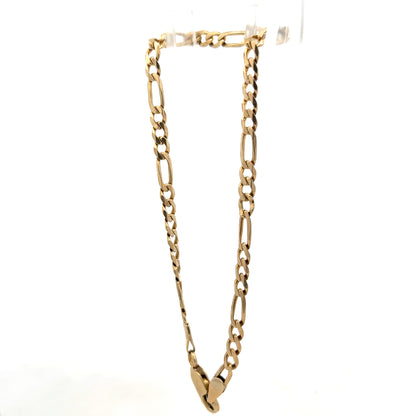 9ct yellow gold Figaro bracelet weighing 4.2g from Reeves and Sons, close-up of the chain links and polished finish.