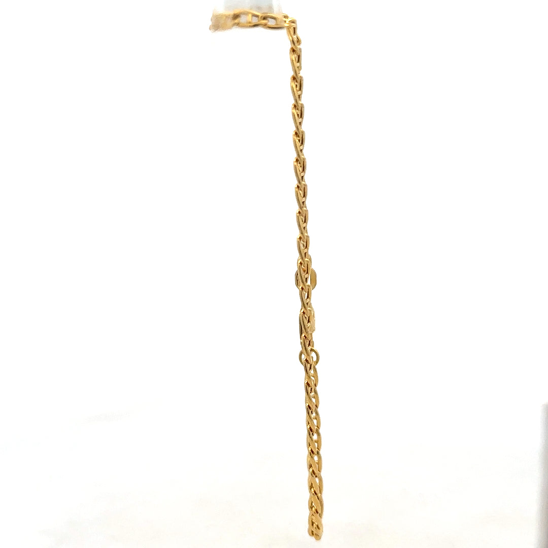 9ct yellow gold bracelet weighing 2.2g from Reeves and Sons, showcasing a sleek and elegant jewelry design.