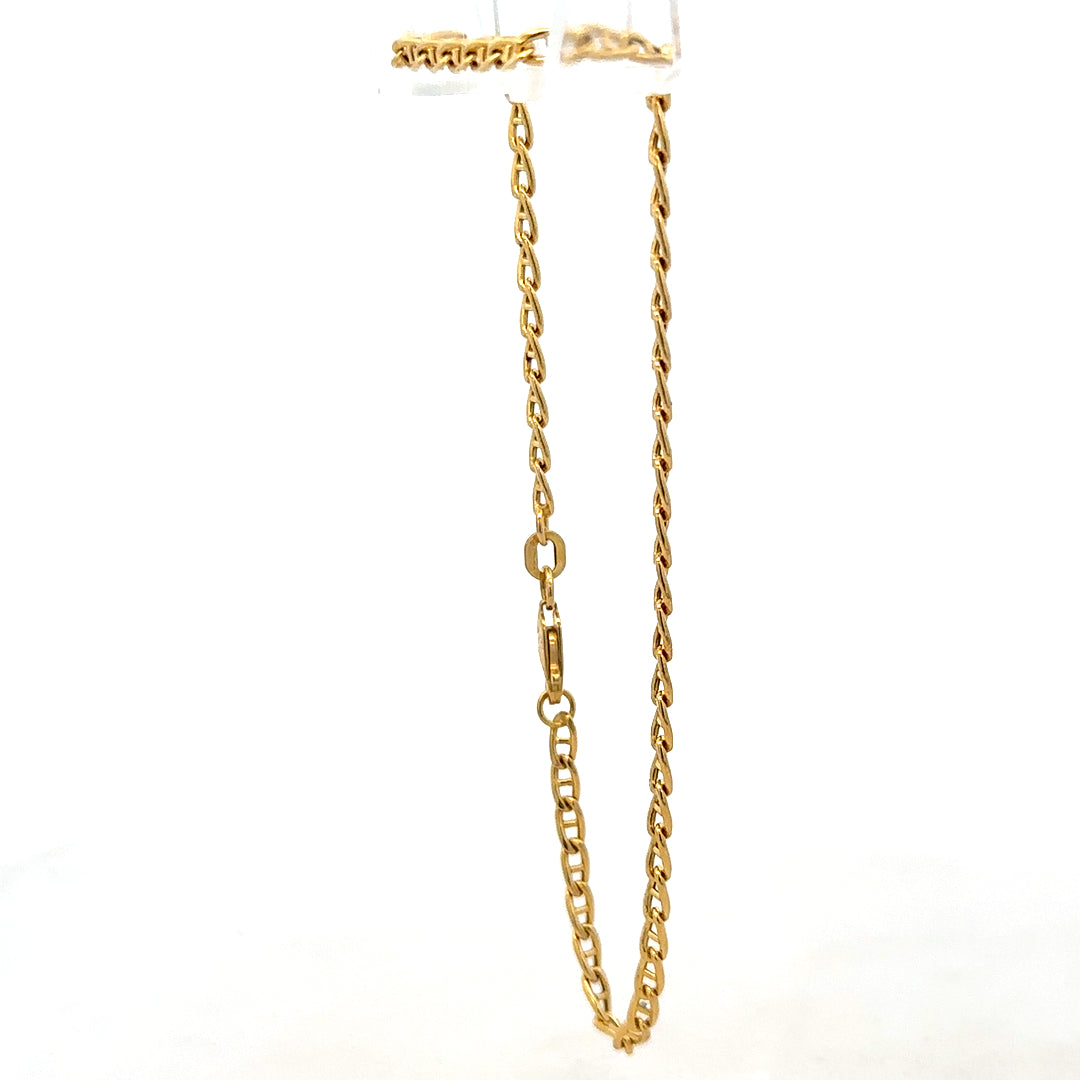 9ct yellow gold bracelet weighing 2.2g, featuring a delicate chain design, from Reeves and Sons.