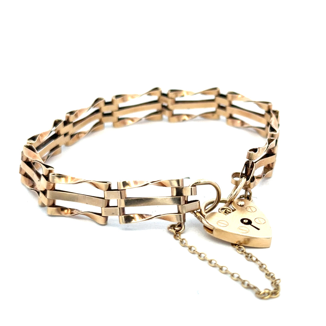 9ct yellow gold gate bracelet weighing 8.4g with a polished finish, featuring interlocking rectangular links.
