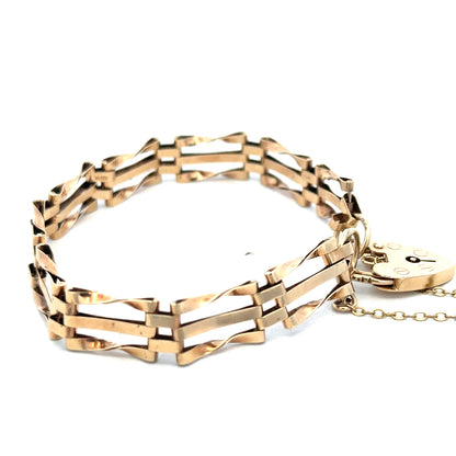 9ct yellow gold gate bracelet with chain links, weighing 8.4g, featuring a secure clasp, by Reeves and Sons