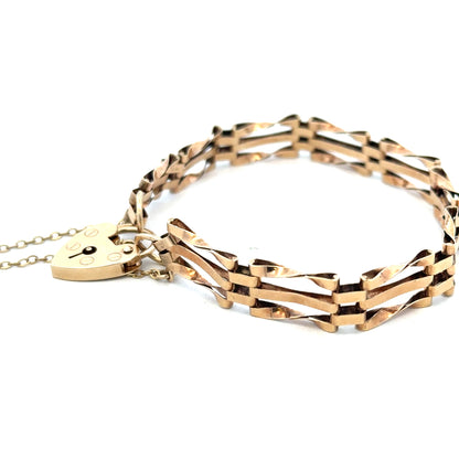 9ct yellow gold gate bracelet weighing 8.4g, featuring interlinked rectangular links and a secure clasp, from Reeves and Sons.