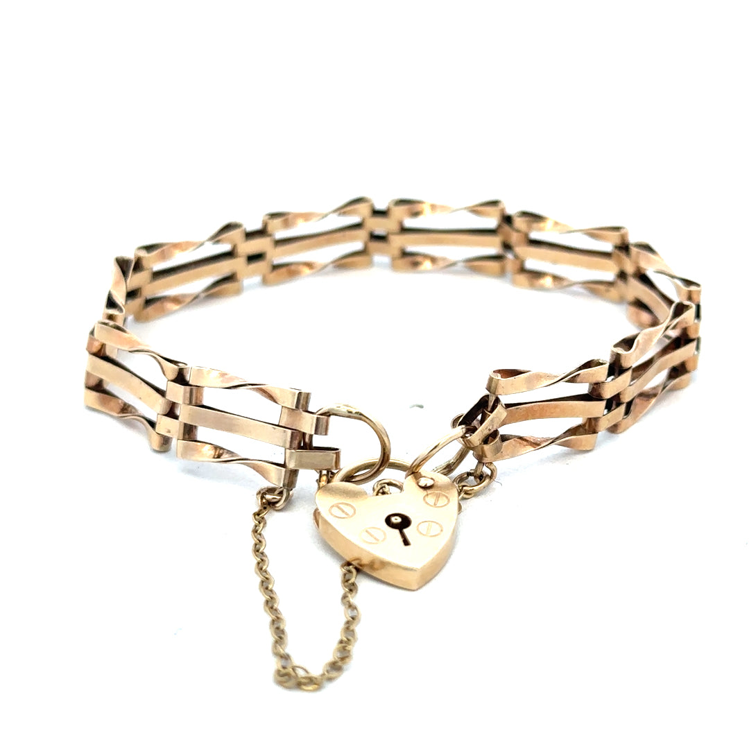 9ct yellow gold gate bracelet weighing 8.4g, featuring linked chain design, from Reeves and Sons.