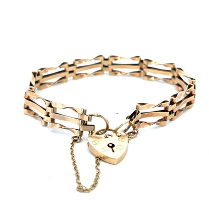 9ct yellow gold gate bracelet weighing 8.4g, featuring linked chain design, from Reeves and Sons.