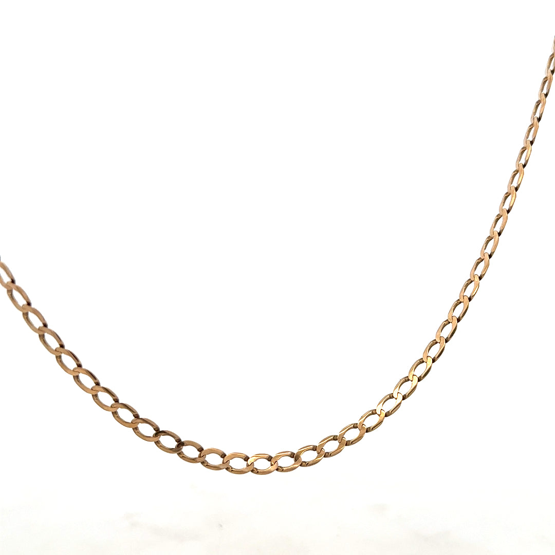 9ct yellow gold curb chain weighing 7.6g, featuring interconnected oval links, crafted by Reeves and Sons.