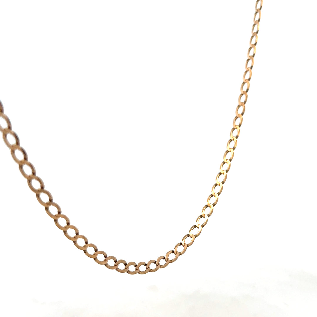 9ct yellow gold curb chain weighing 7.6g, featuring interlocking oval links, crafted by Reeves and Sons.
