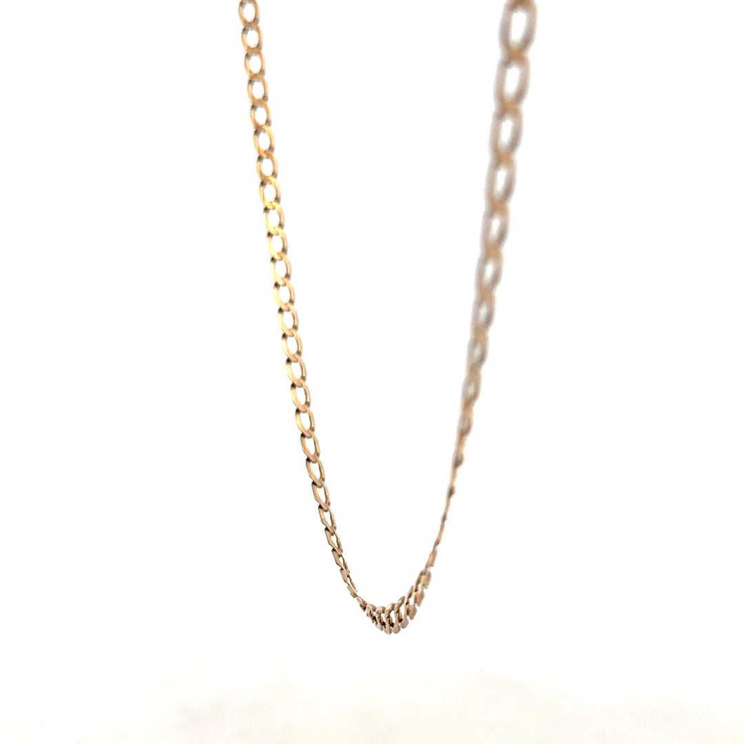 9ct yellow gold curb chain weighing 7.6g, featuring a classic design from Reeves and Sons, shown in close-up detail.