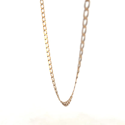 9ct yellow gold curb chain weighing 7.6g, featuring a classic design from Reeves and Sons, shown in close-up detail.