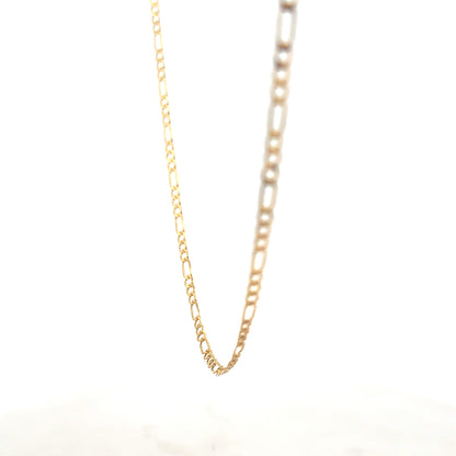 9ct yellow gold Figaro chain weighing 3.3g with intricate links, crafted by Reeves and Sons, shown in close-up detail.