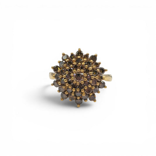 9ct yellow gold diamond cluster ring by Reeves and Sons, featuring a sparkling diamond cluster design.