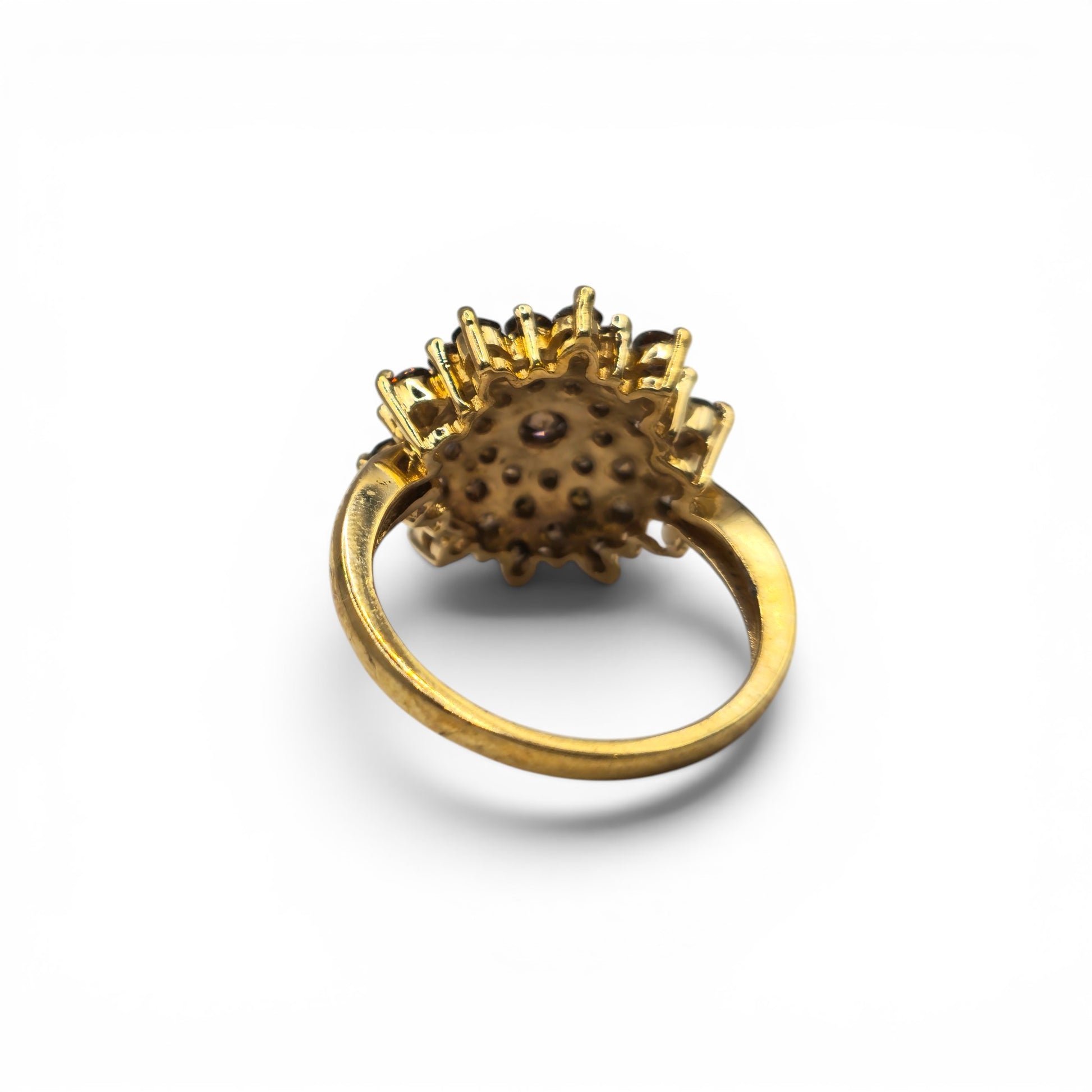 9ct yellow gold diamond cluster ring by Reeves and Sons, featuring a sparkling diamond cluster design on a polished gold band.