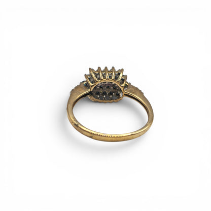 9ct yellow gold diamond ring by Reeves and Sons, featuring sparkling diamonds and a polished gold band.